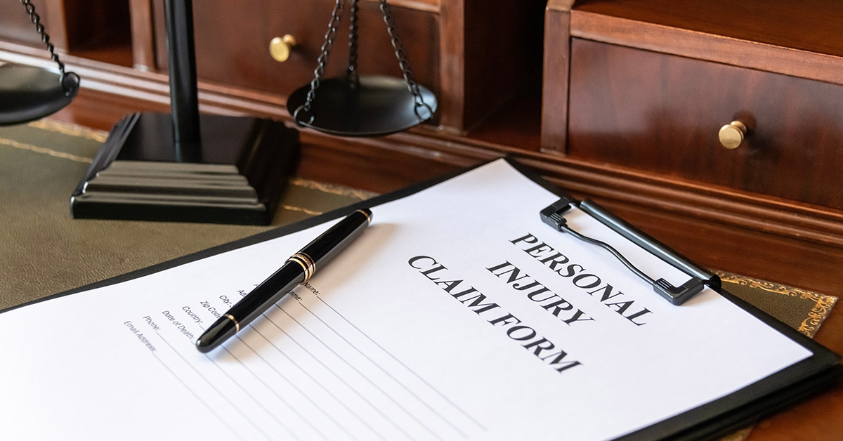 Lawyer reviewing an insurance settlement offer with an injured client