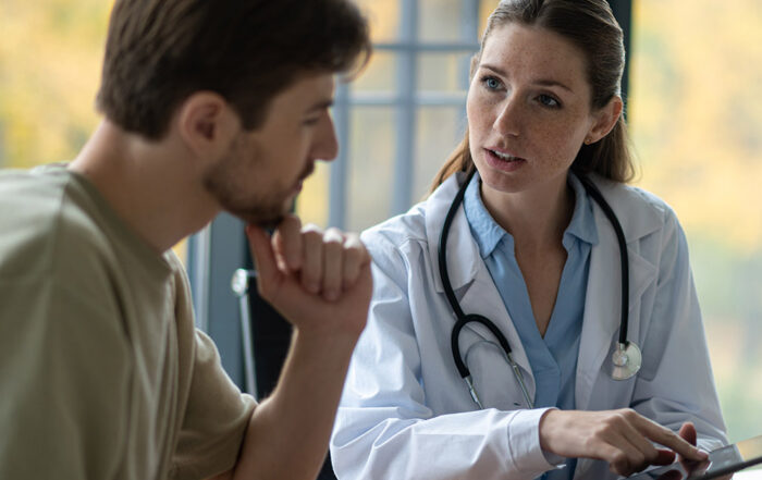 Doctor discussing a missed diagnosis in Massachusetts with a patient