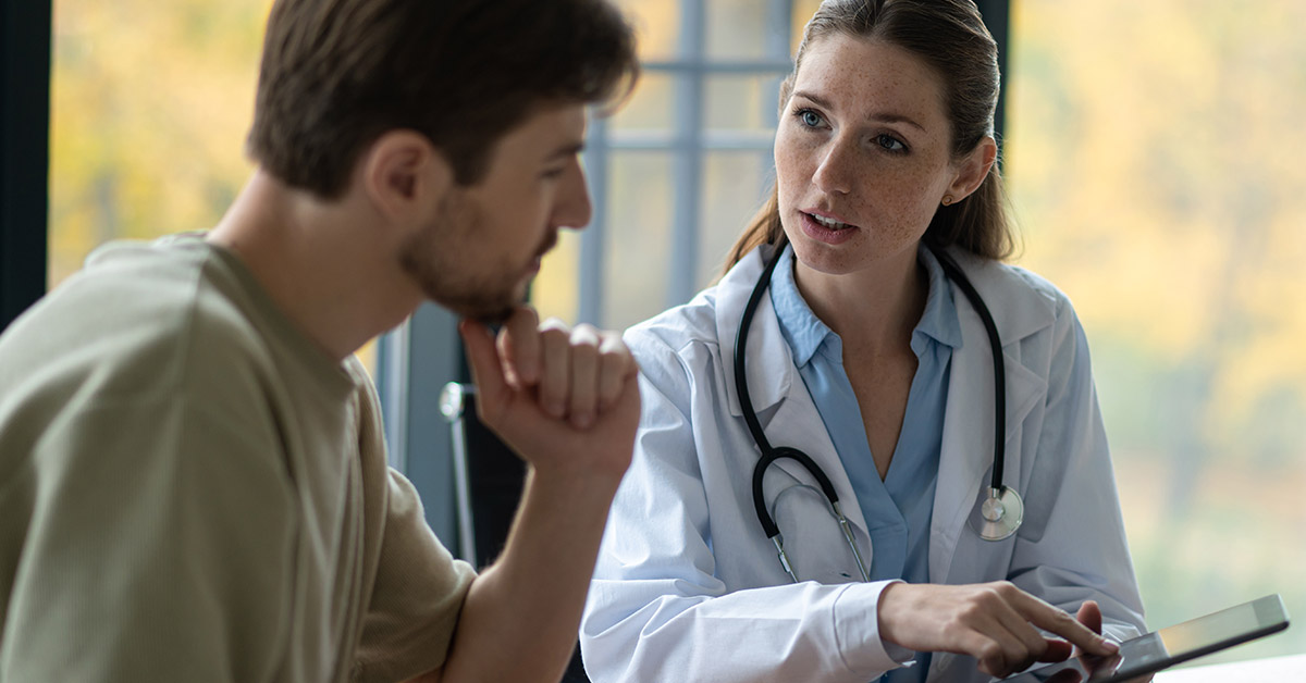 Doctor discussing a missed diagnosis in Massachusetts with a patient