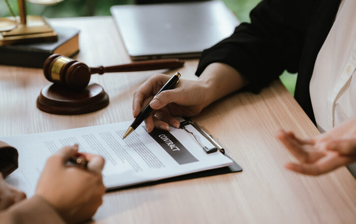 Personal injury lawyer reviewing a first settlement offer with an injured client