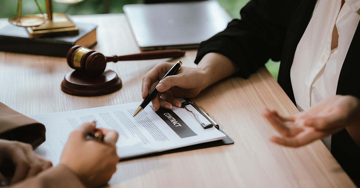 Personal injury lawyer reviewing a first settlement offer with an injured client