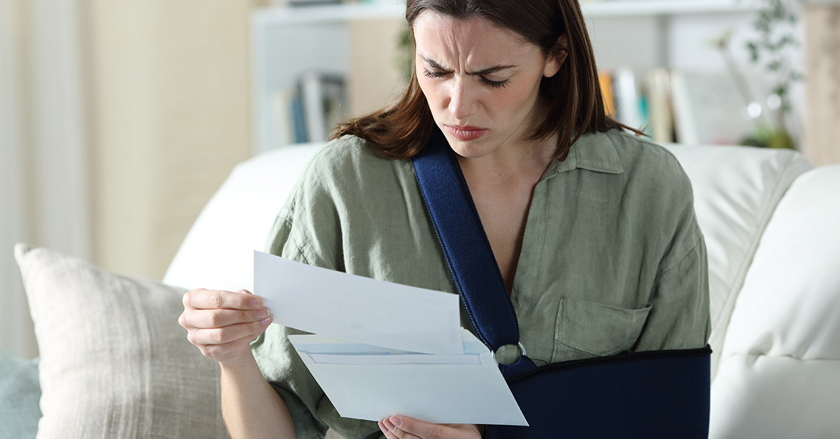 Denied personal injury claim in Massachusetts with insurance documents and denial letter