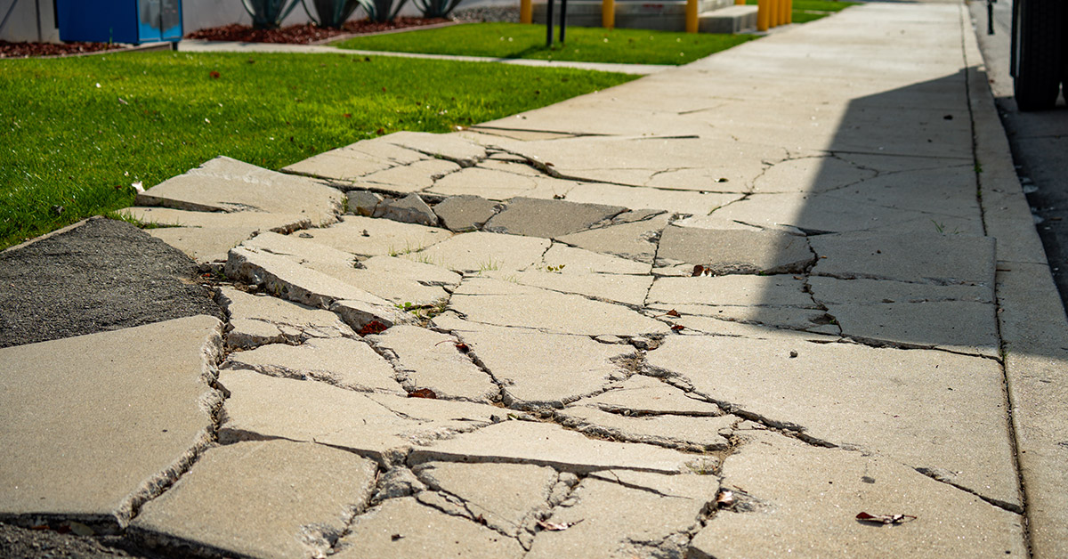 Broken uneven sidewalk causing a potential sidewalk injury in Massachusetts